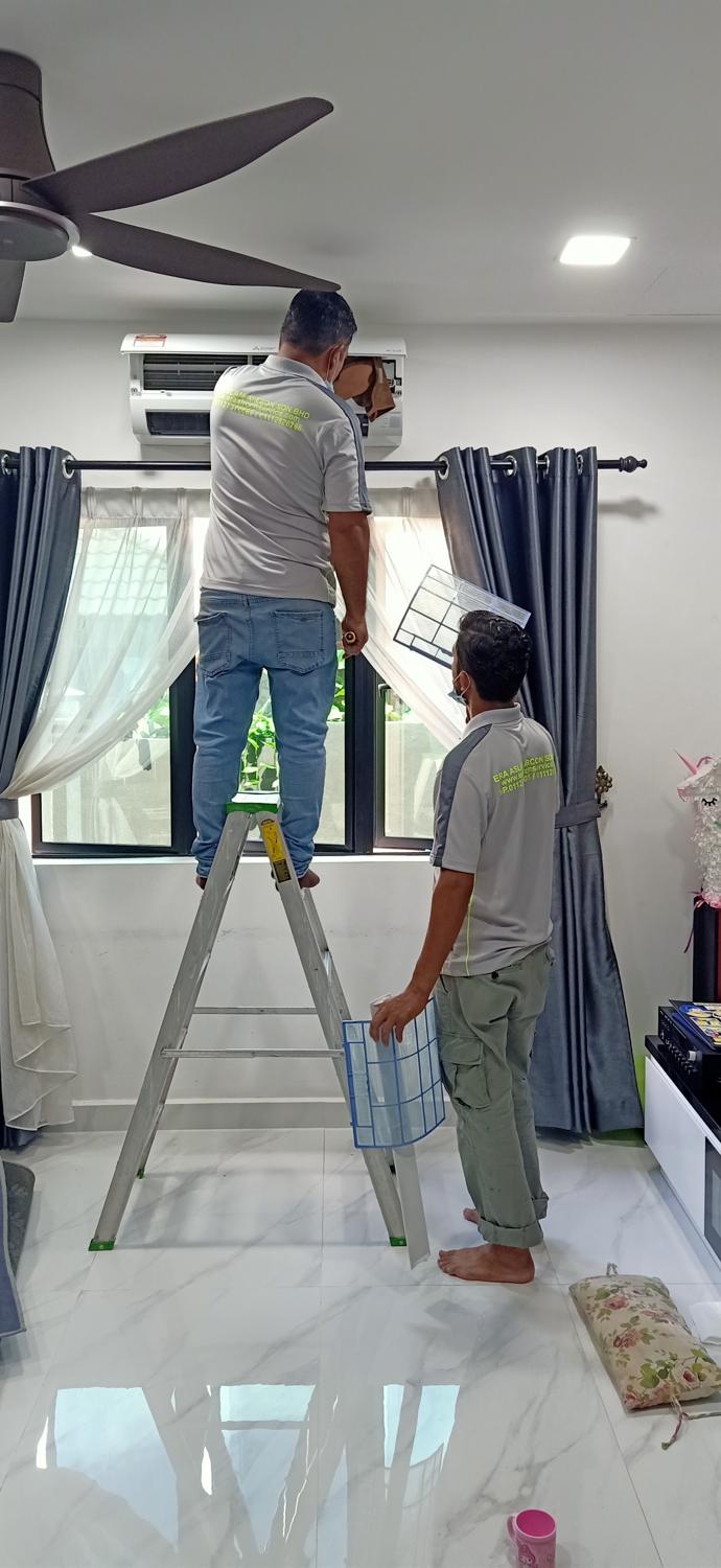 Two technicians at a wall unit